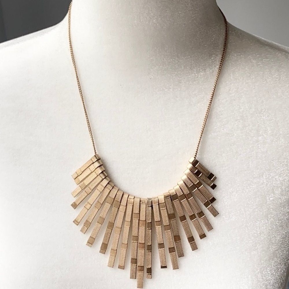 Gold tone metal reversible multi bar bib necklace